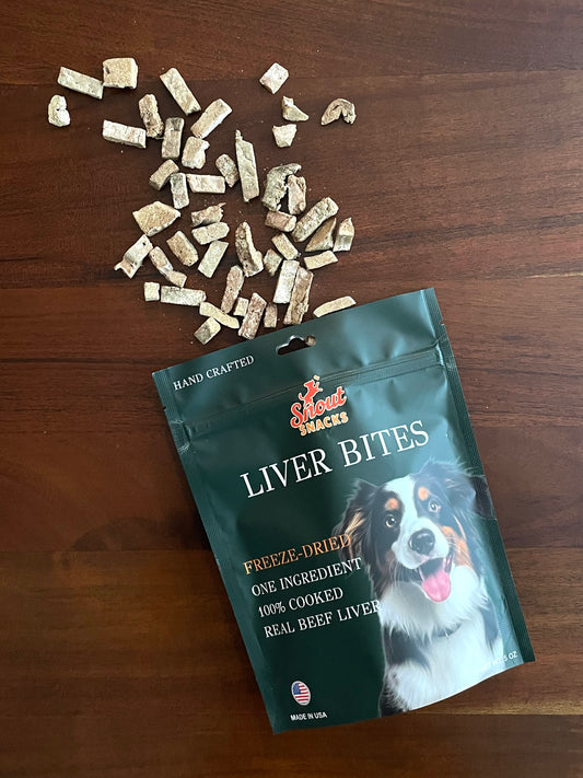 Bag of freeze-dried liver bites for dogs on a wooden surface